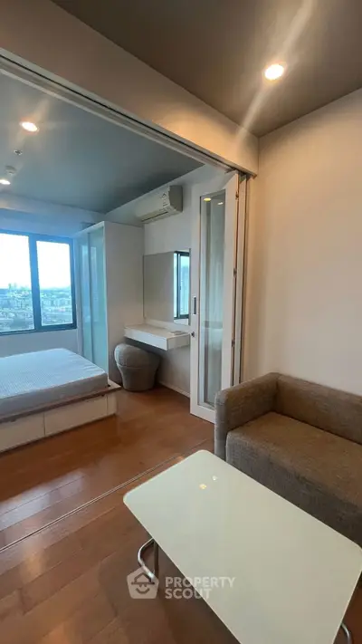 Modern studio apartment with sliding doors and city view