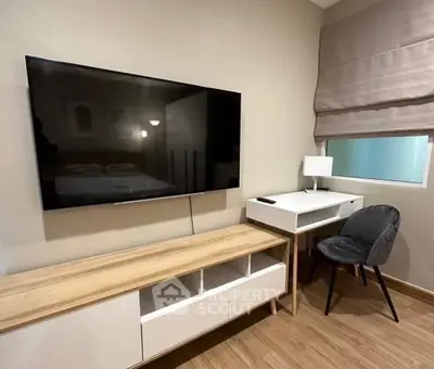 Modern living room with sleek TV setup and stylish furniture