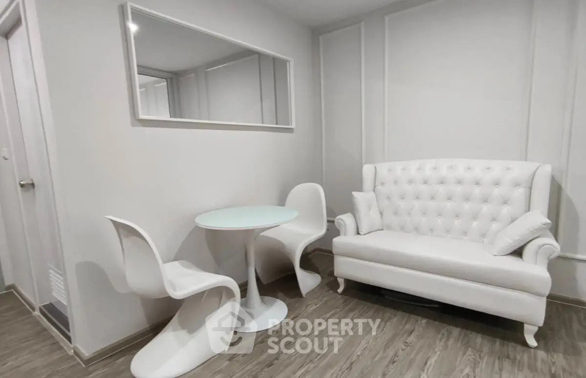 Modern minimalist living room with white furniture and elegant decor