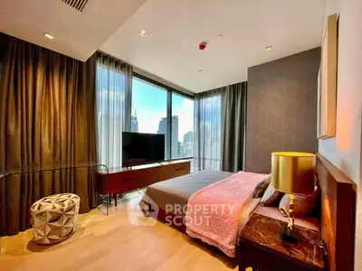 Luxurious bedroom with stunning city view and modern decor in high-rise apartment