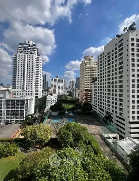 Stunning cityscape view with high-rise buildings and lush greenery, perfect for urban living.