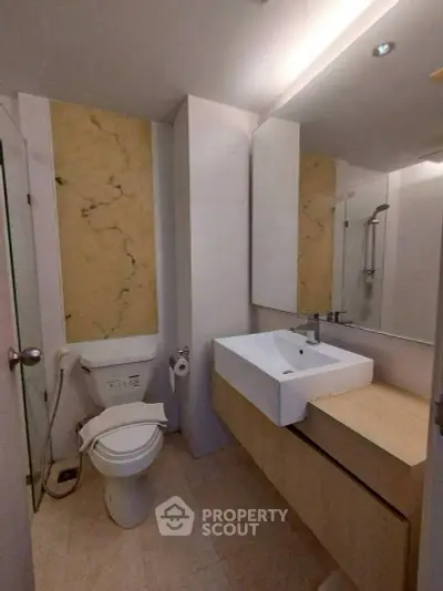 Modern bathroom with sleek fixtures and elegant marble accents