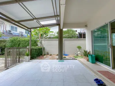 Spacious covered patio with garden view in modern home