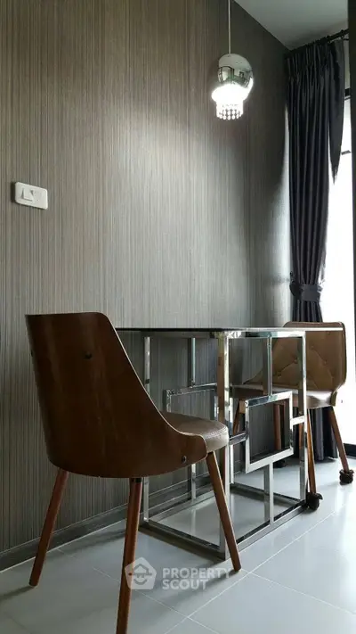 Modern study area with sleek furniture and stylish lighting in a contemporary home.