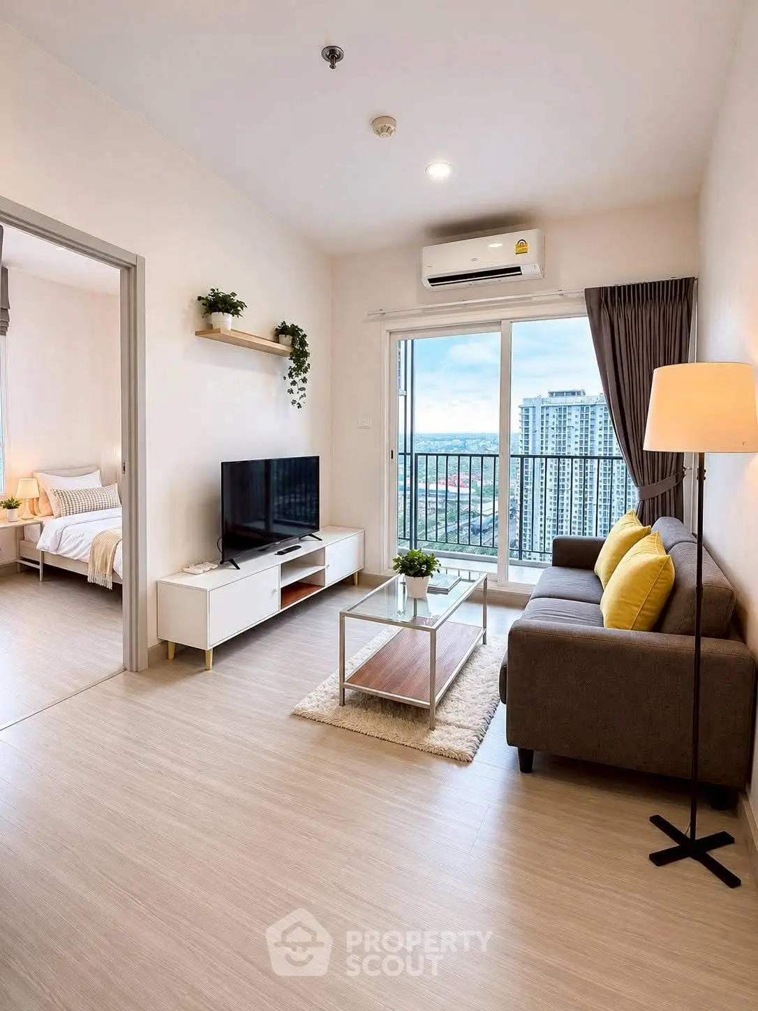 Modern living room with balcony view in high-rise apartment
