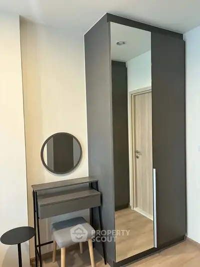 Modern bedroom with sleek wardrobe and stylish vanity set