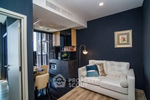 Modern living room with stylish decor and open kitchen layout