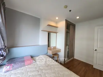 Cozy bedroom with modern design, featuring a comfortable bed, built-in wardrobe, and stylish wooden flooring.