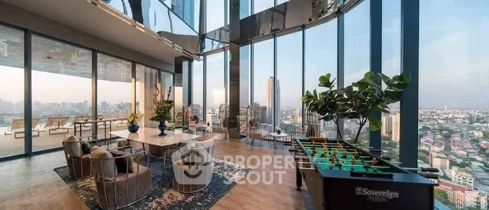 Luxurious high-rise living room with panoramic city views and modern decor.