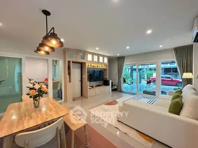 Modern living room with stylish decor and large windows offering natural light