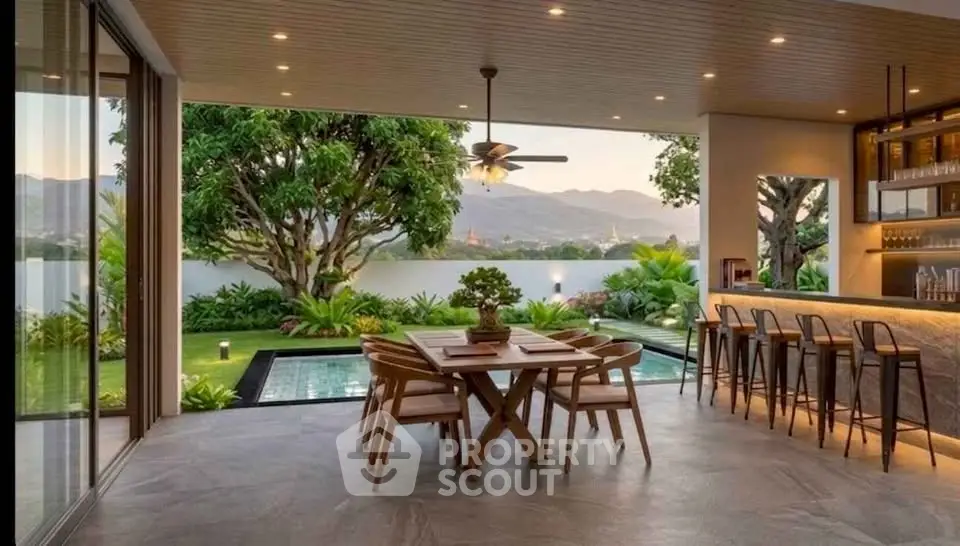 Luxurious open-air dining area with pool and scenic mountain view