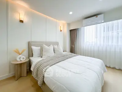 Elegant bedroom with cozy lighting and stylish decor in modern apartment