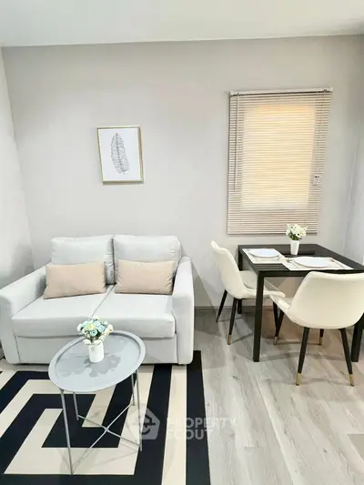 Modern living room with cozy sofa and stylish dining area