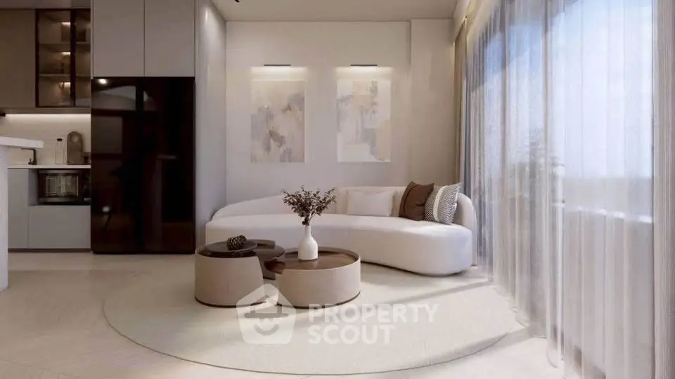 Elegant modern living room with sleek furniture and large windows offering natural light.