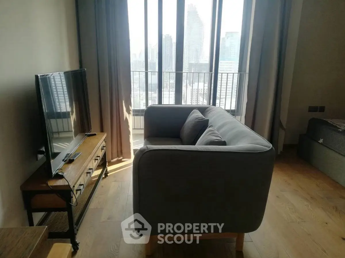 Cozy living room with modern sofa and city view through large windows