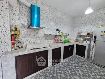 Modern kitchen with mosaic tiles and stainless steel appliances
