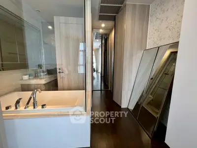 Luxurious bathroom with modern design and elegant bathtub in upscale apartment.