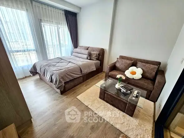 Cozy bedroom with stylish brown furniture and natural light