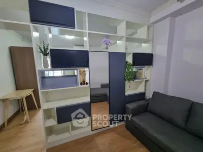 Modern living room with stylish shelving and comfortable sofa