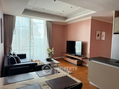 Spacious modern living room with large windows and stylish decor in a high-rise apartment.