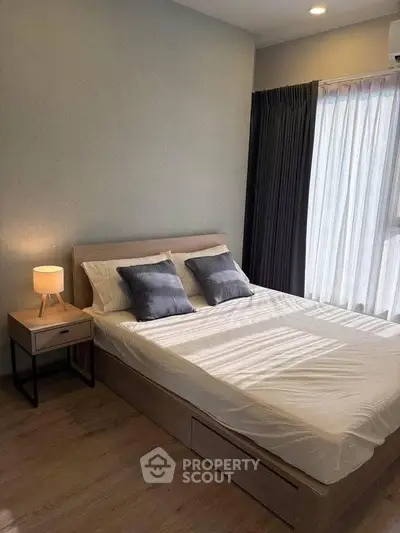 Cozy bedroom with modern decor and natural light