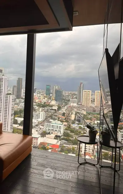 Luxurious high-rise apartment with stunning city view from the living room.