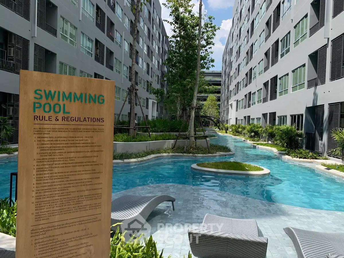 Modern apartment complex with inviting swimming pool and lush greenery