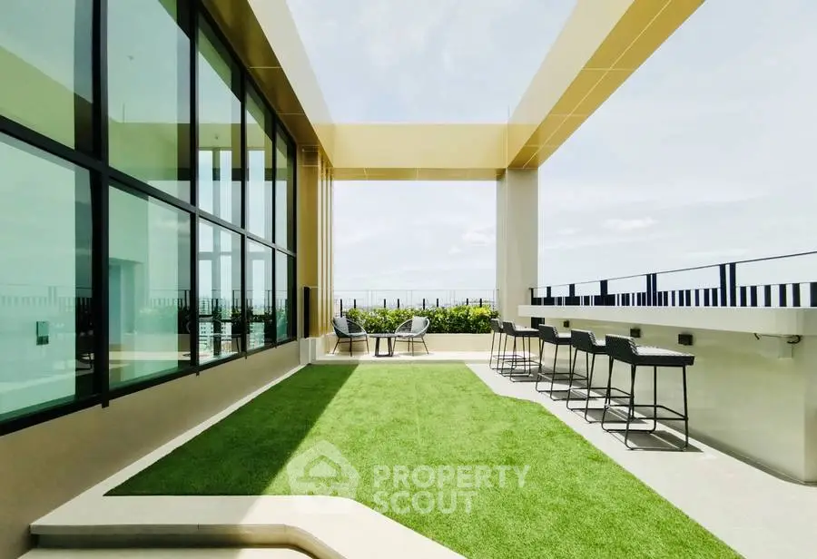 Luxurious rooftop terrace with modern seating and stunning city views.