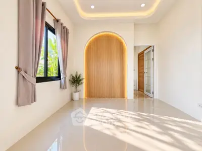 Bright and modern interior with elegant lighting and large window, perfect for a stylish living space.