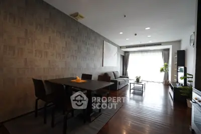 Spacious modern living room with dining area and large window view