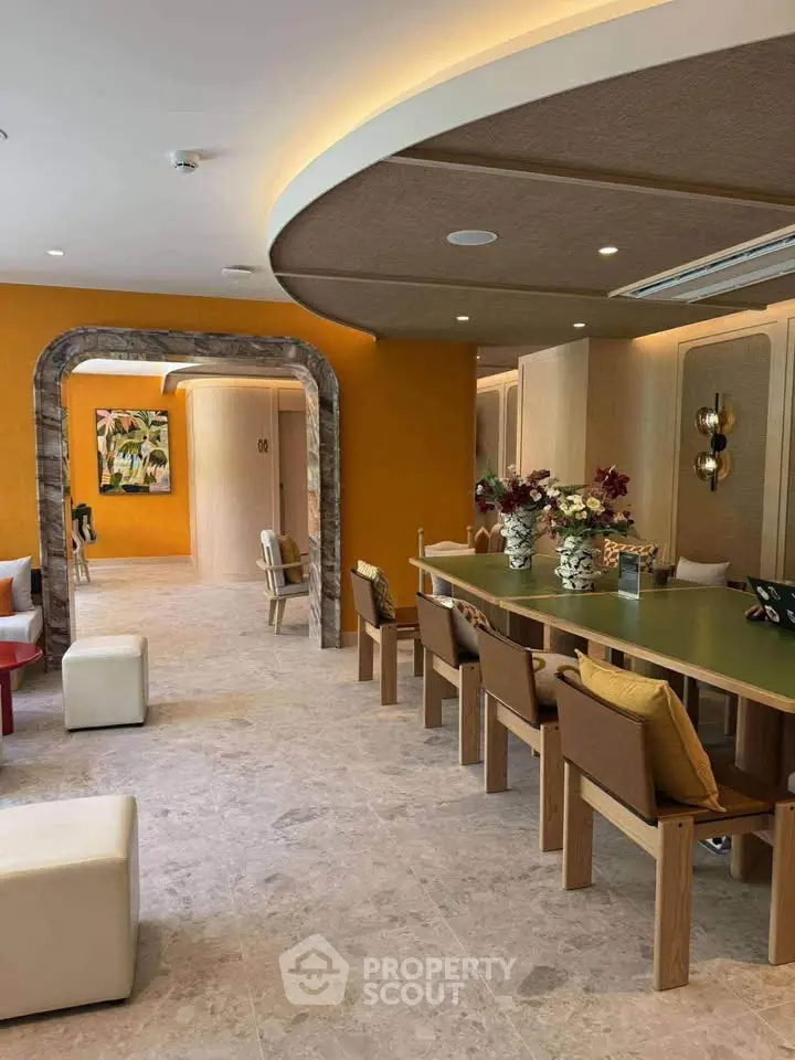 Luxurious modern living room with elegant decor and spacious seating area.