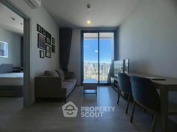Modern living room with balcony view in high-rise apartment