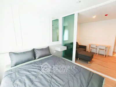 Modern studio apartment with cozy bedroom and stylish living area
