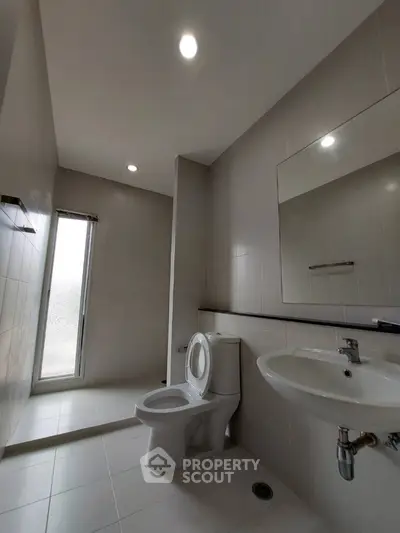 Modern bathroom with sleek design and natural lighting