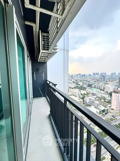 High-rise balcony with stunning cityscape view, perfect for urban living.