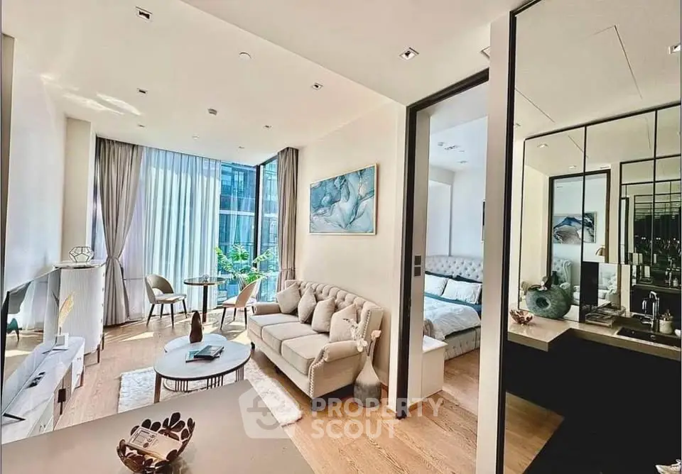 Luxurious modern living room with elegant decor and large windows offering abundant natural light.