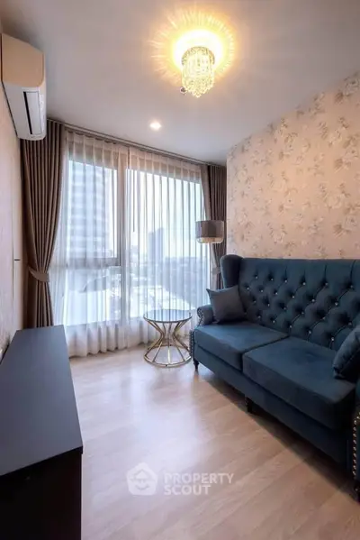Chic living room with elegant blue sofa and city view