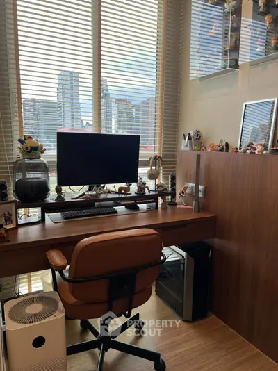 Modern study room with city view, featuring sleek desk, ergonomic chair, and stylish decor.