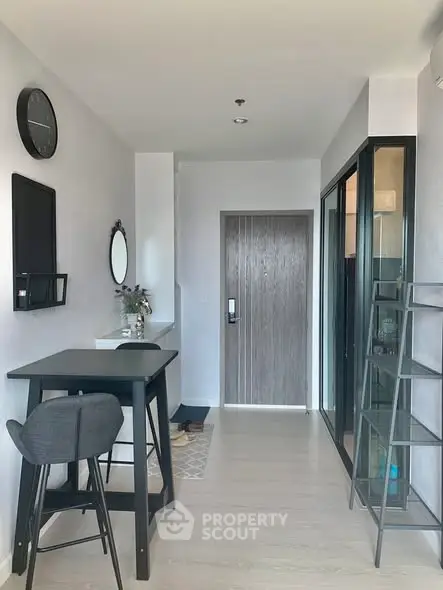Modern apartment entrance with sleek decor and stylish furniture