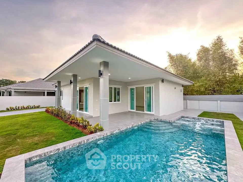 Stunning modern house with private pool and lush garden, perfect for luxury living.