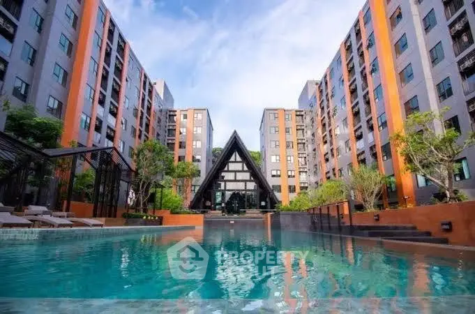 Luxurious apartment complex with stunning pool and modern architecture