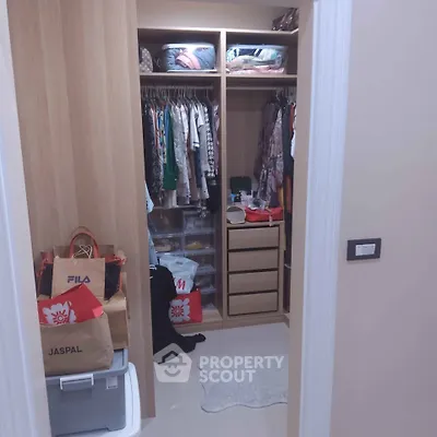 Spacious walk-in closet with organized storage and hanging space