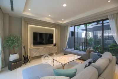 Luxurious modern living room with large sofa and entertainment center
