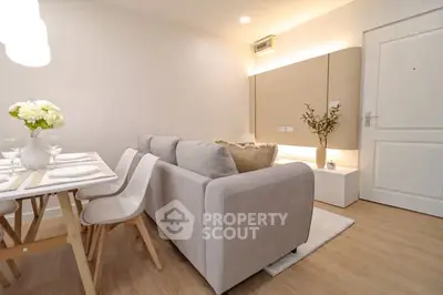 Modern living room with dining area, cozy sofa, and elegant decor