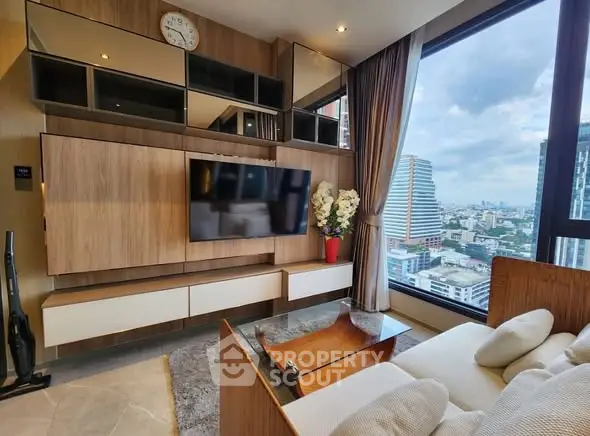 Modern living room with city view, stylish wood paneling, and cozy seating area.