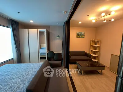 Modern studio apartment with stylish furniture and open layout in a cozy living space.