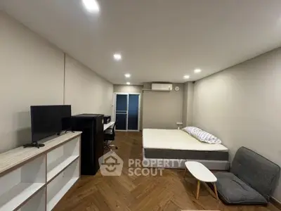Modern studio apartment with sleek design and cozy furnishings, perfect for urban living.
