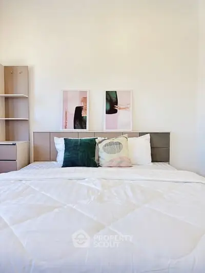 Modern bedroom with stylish decor and cozy bedding