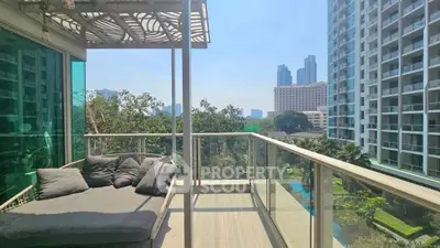 Spacious balcony with city view in modern apartment complex, perfect for relaxation.