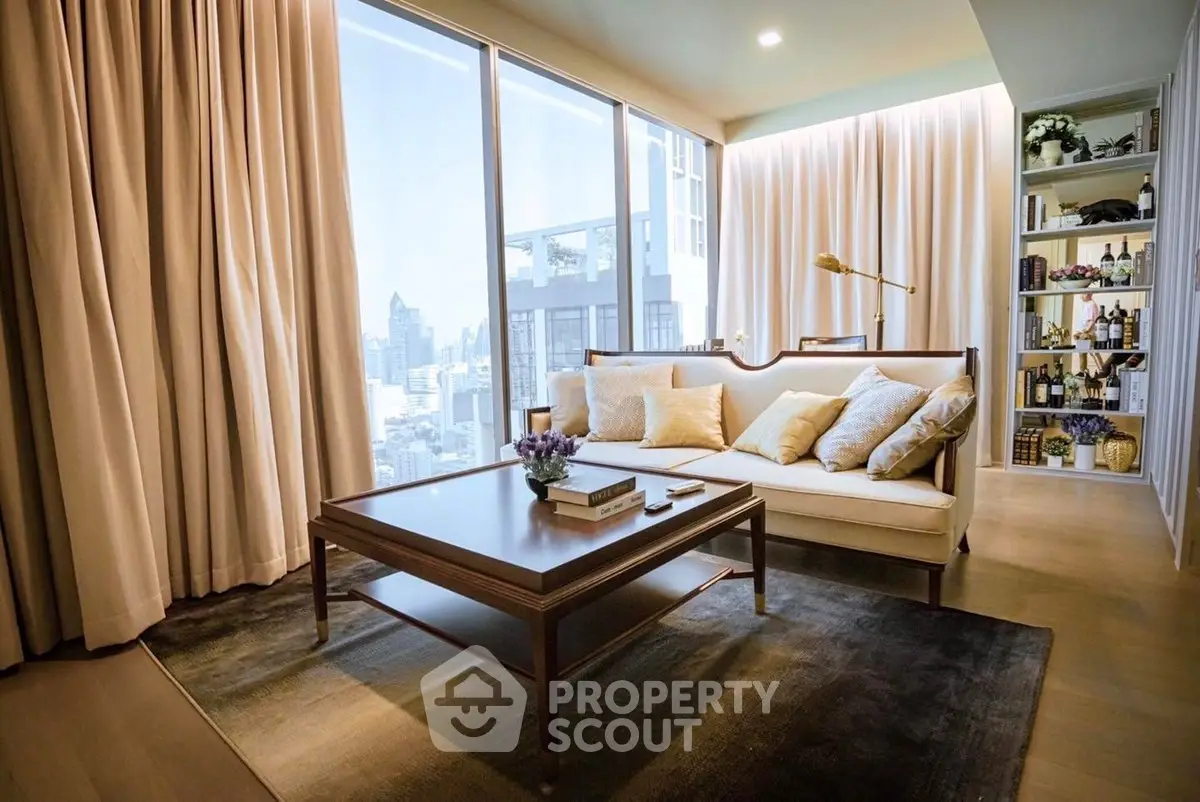 Luxurious living room with city view, elegant decor, and ample natural light.